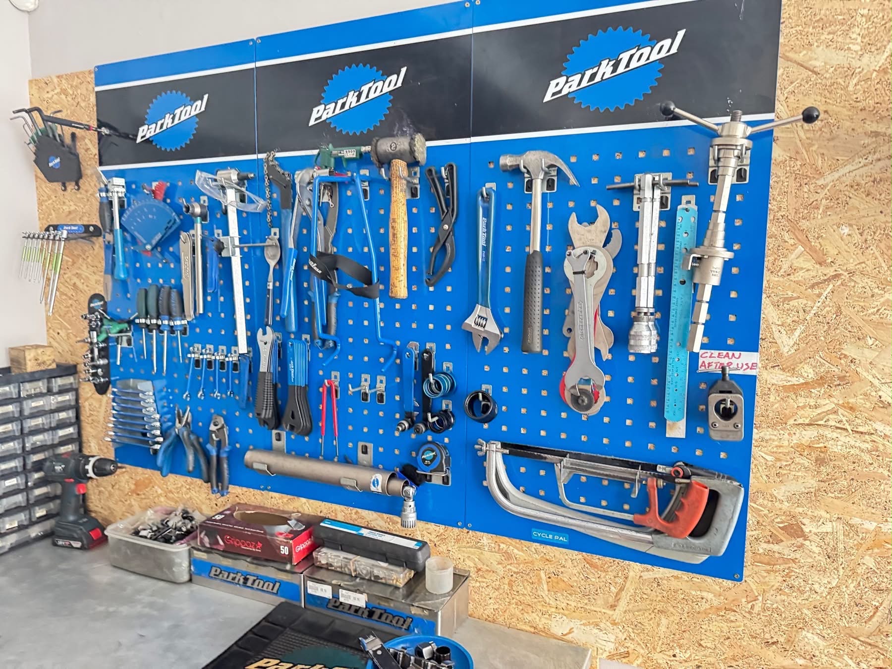 Billy’s neatly arranged bicycle repair tools on blue workshop boards